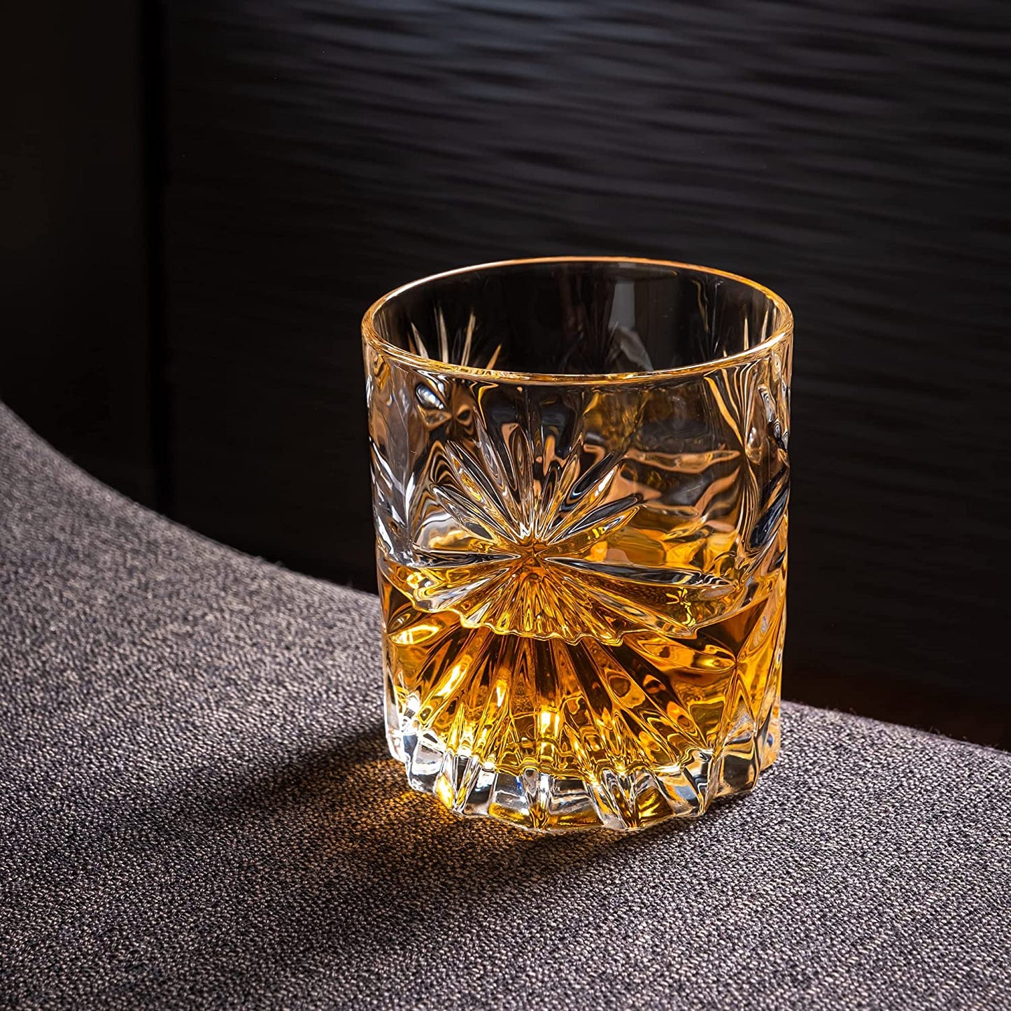 ROCKS - The Privilege Collection - Soleil Glass of whiskey with intricate design on a dark surface