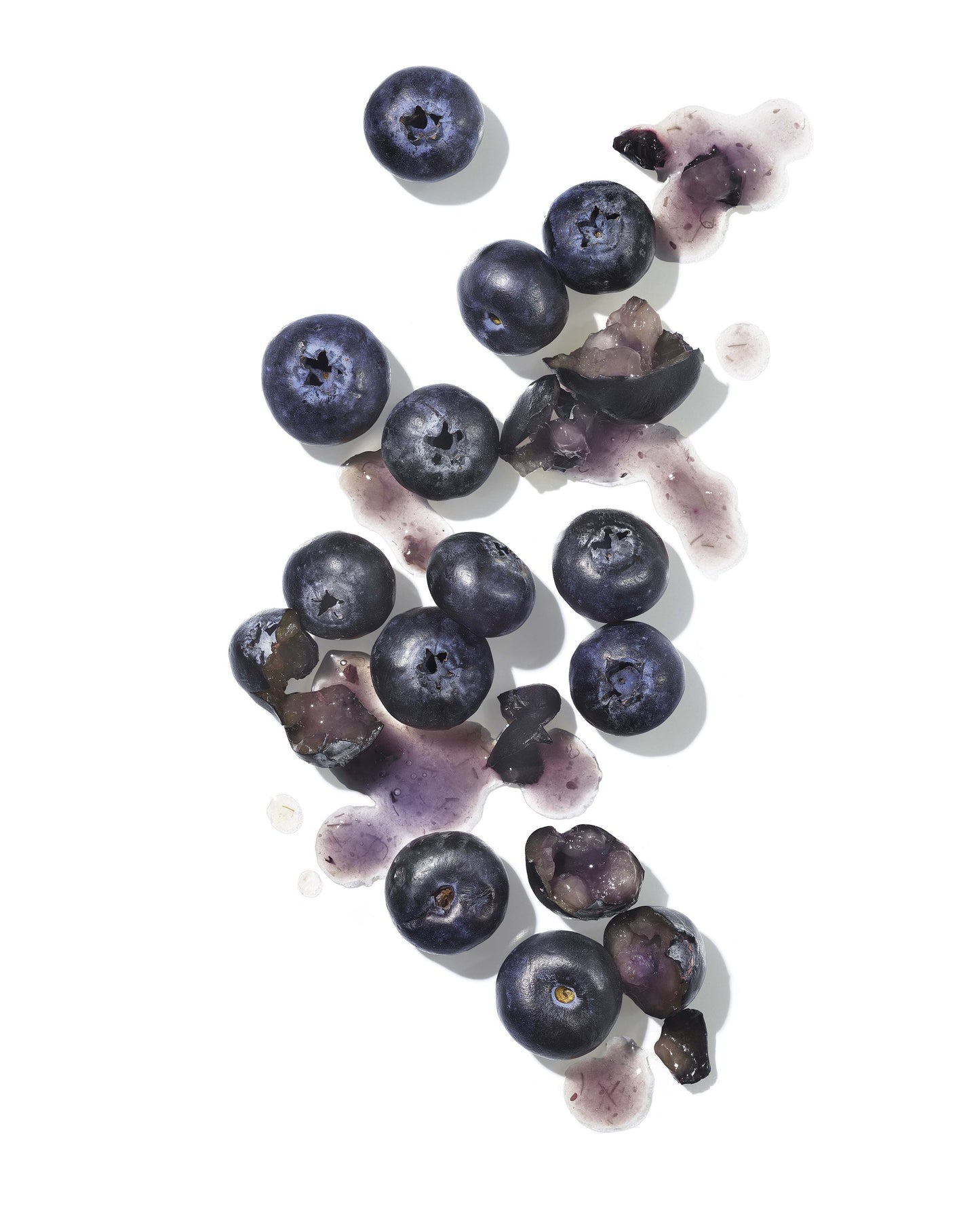Blueberries scattered on a white background