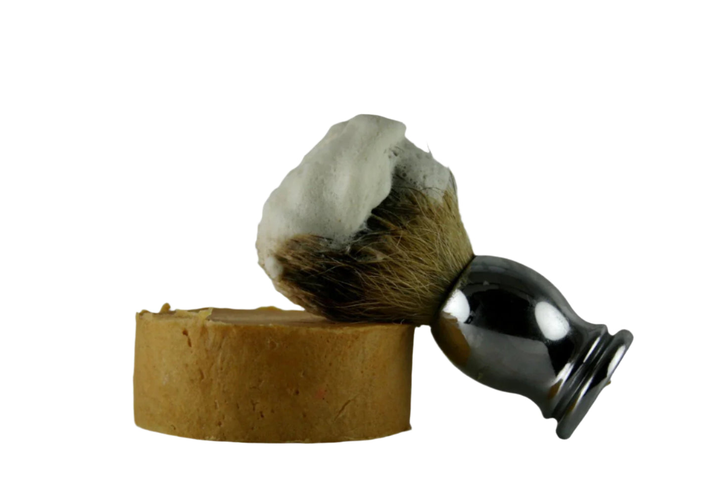 Shaving brush with foam and stand on a white background