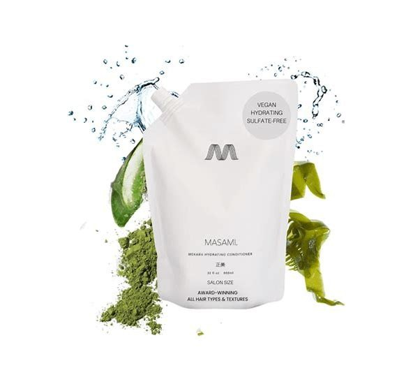 White bottle of Masami hair product with green leaves and water droplets on a white background