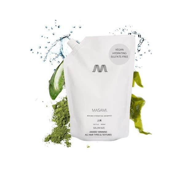 MASAMU shampoo bottle with green leaves and water droplets on a white background