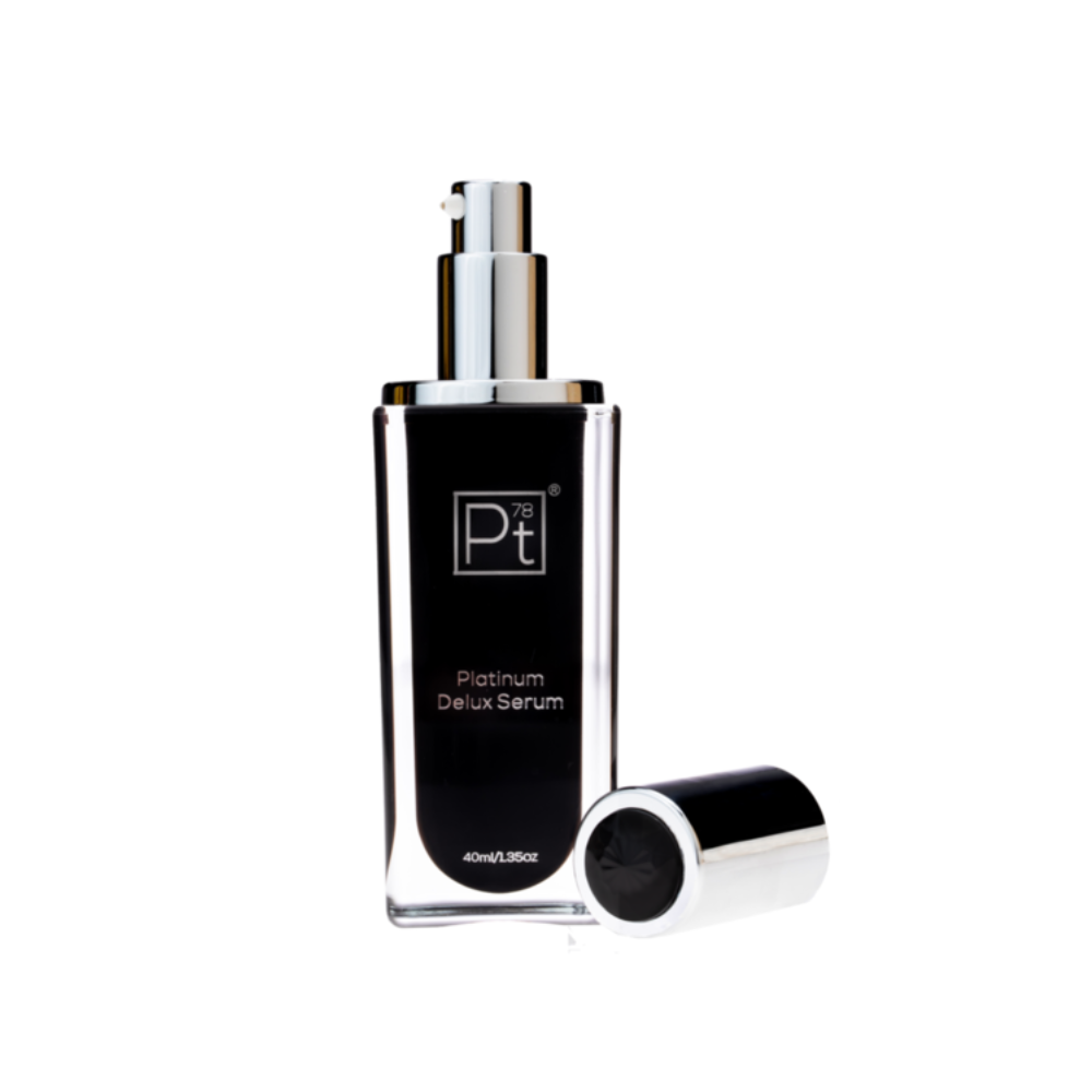 Serum bottle labeled 'Platinum Deluxe Serum' on a white background