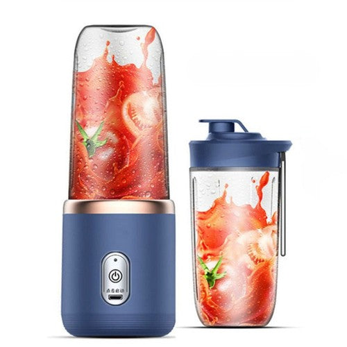 Blue portable blender with a clear container filled with a red smoothie on a white background