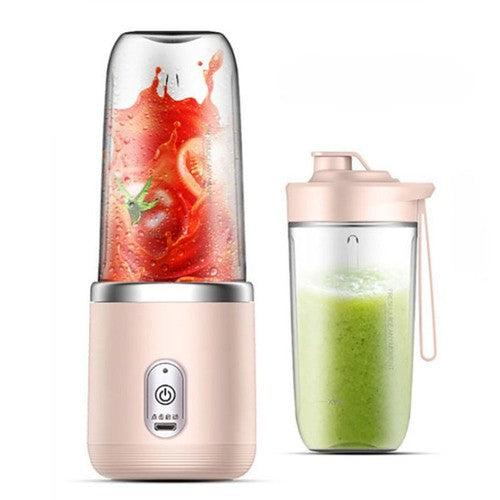Portable blender with a glass container filled with red liquid and a clear container with green liquid on a white background.