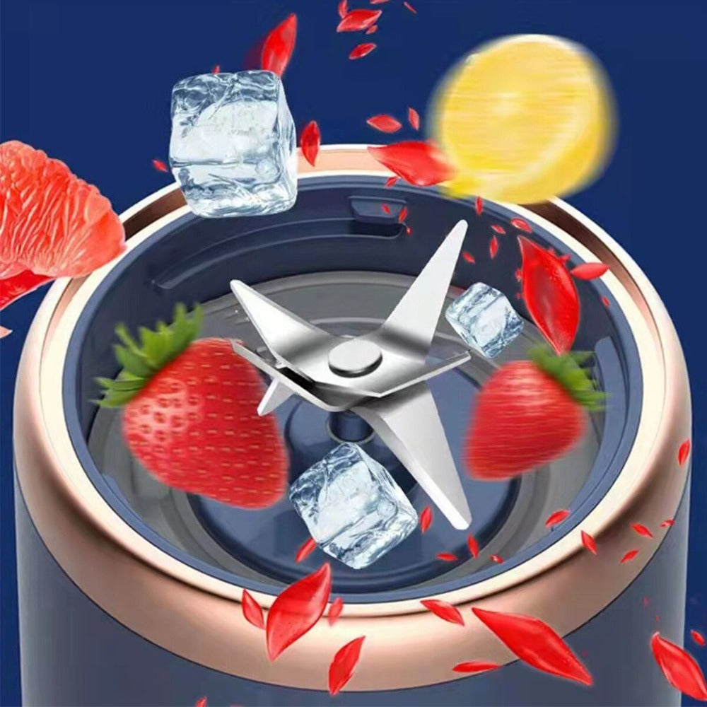 Blender with ingredients like strawberries, lemon, and ice cubes on a blue background