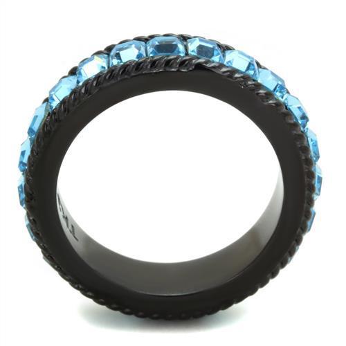 Black ring with blue gemstones on a white background