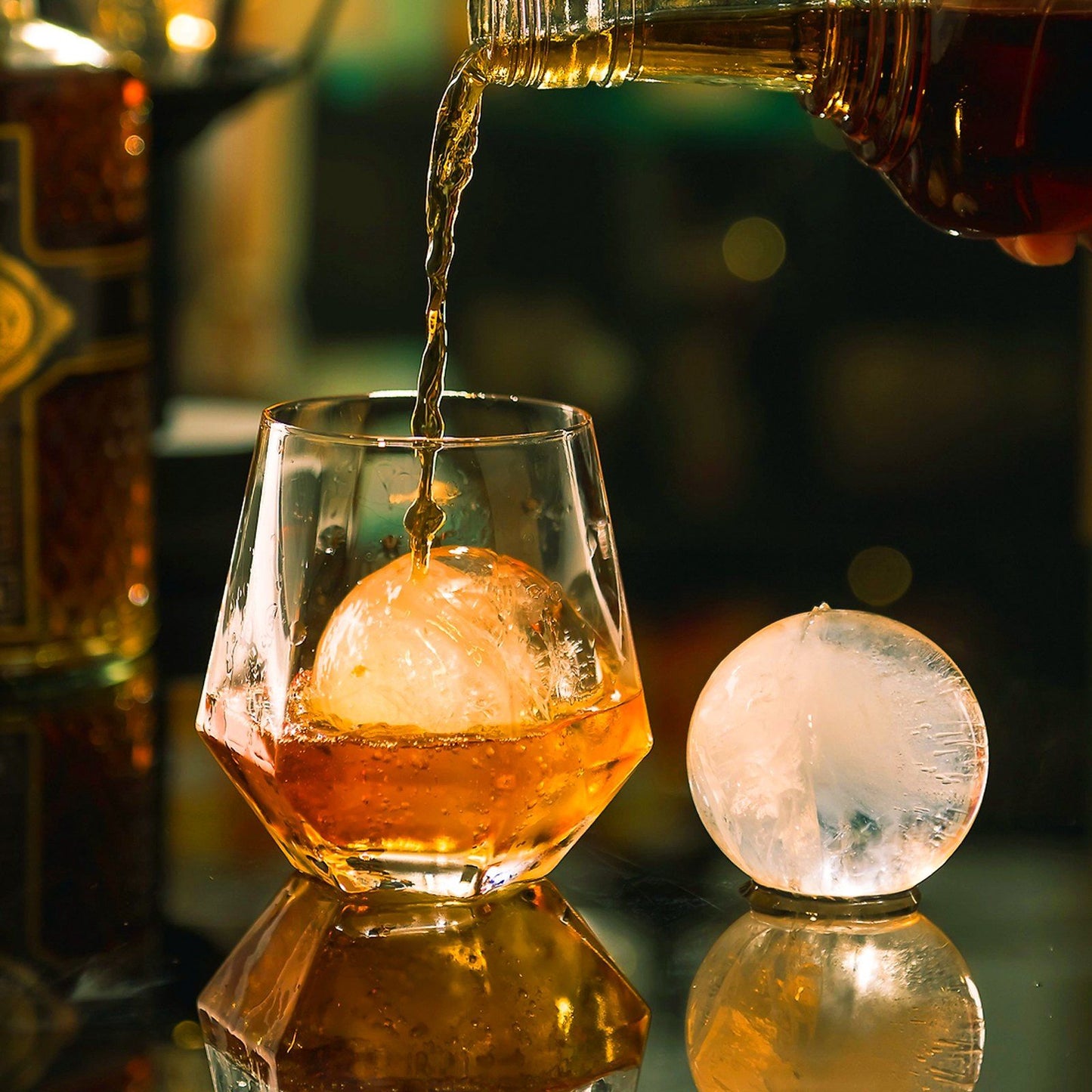 Vevor Ice Sphere, and image of drink pouring from a bottle into a glass.