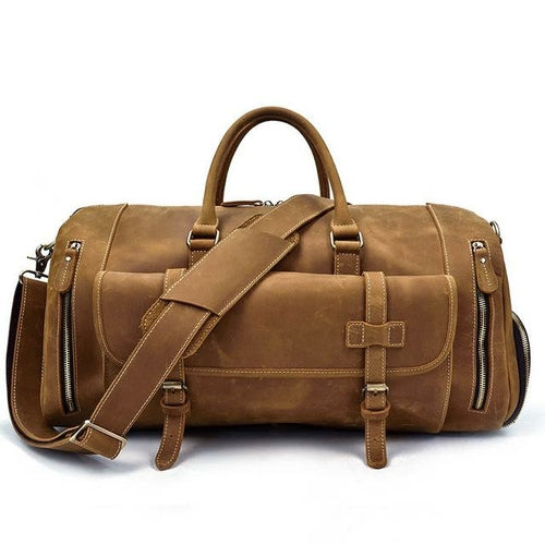 Light Brown leather duffel bag with shoulder strap on a white background