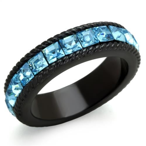 Black ring with blue gemstones on a white background