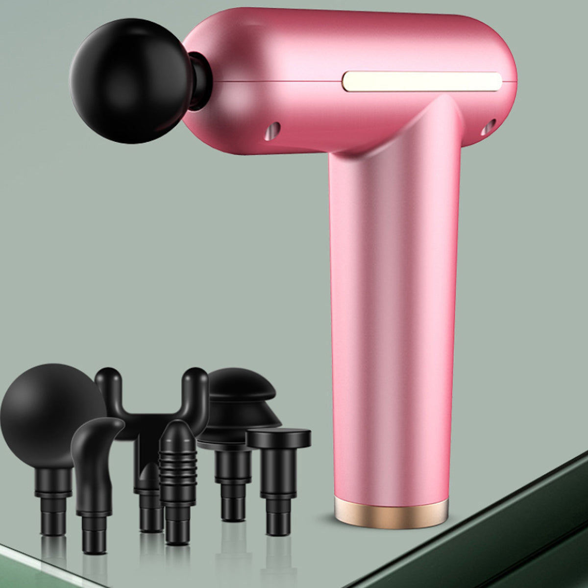 Pink handheld massage device with black attachments on a gray background