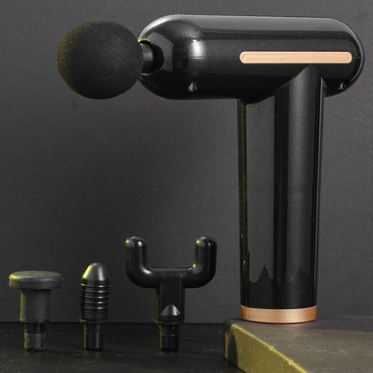 Black handheld massage device with attachments on a dark background