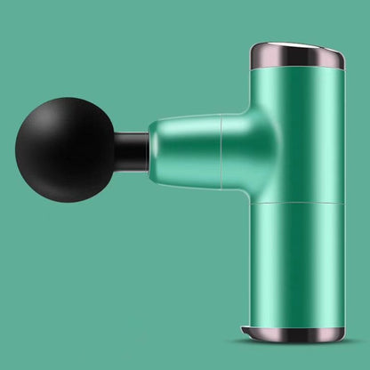 Green massage gun with black handle on a teal background