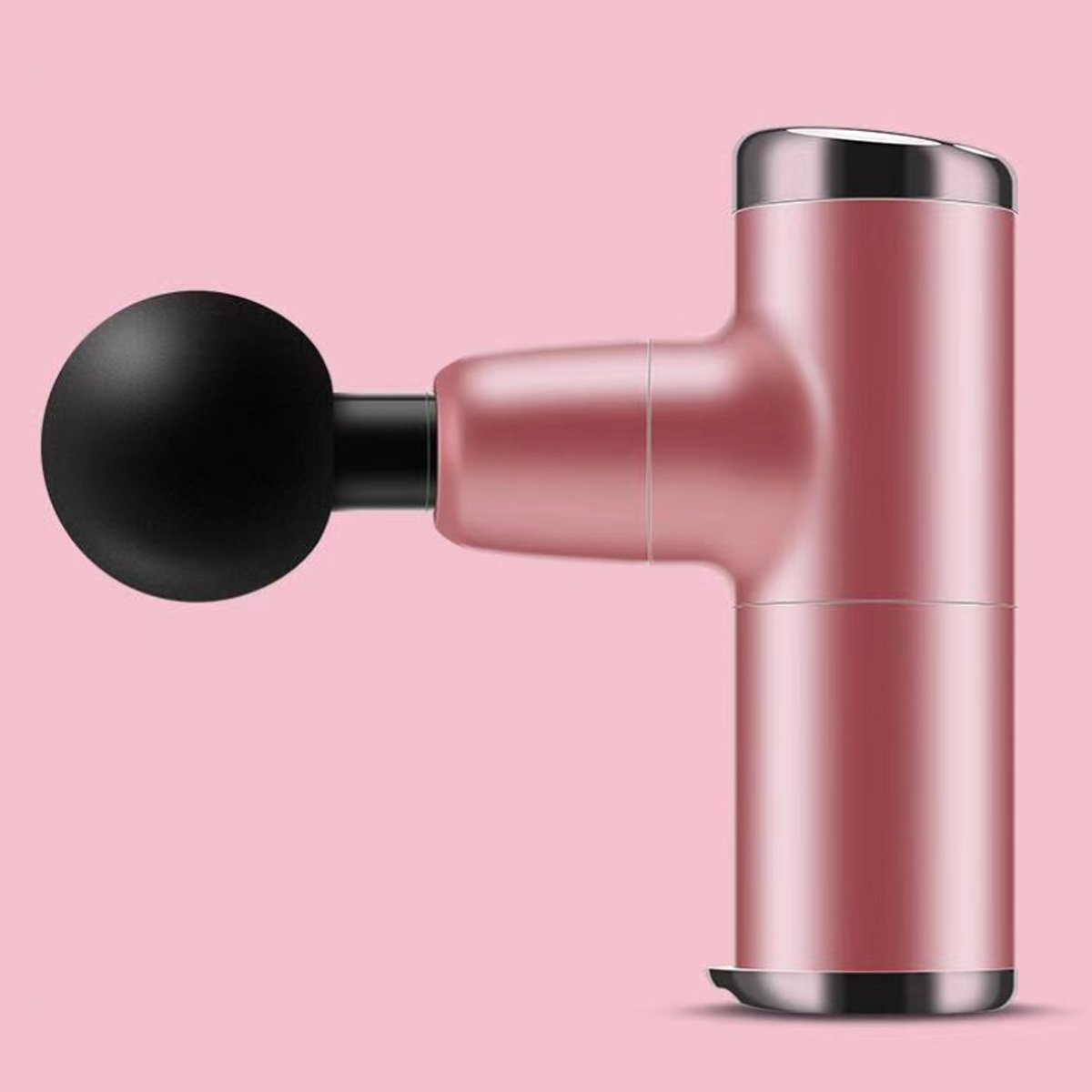 Pink handheld massager with black handle on a pink background