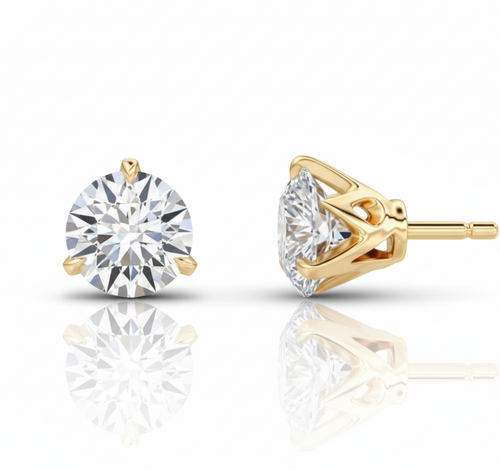 Gold stud earrings with clear gemstones on a white background