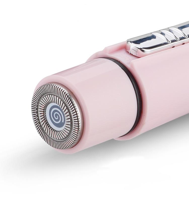 Pink electric shaver on a white background