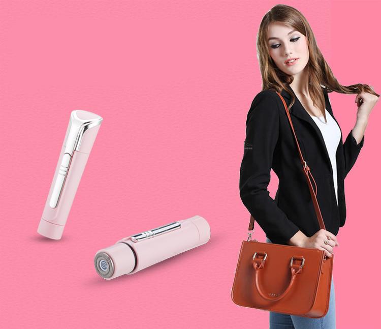 Woman holding a brown handbag with hair styling products on a pink background