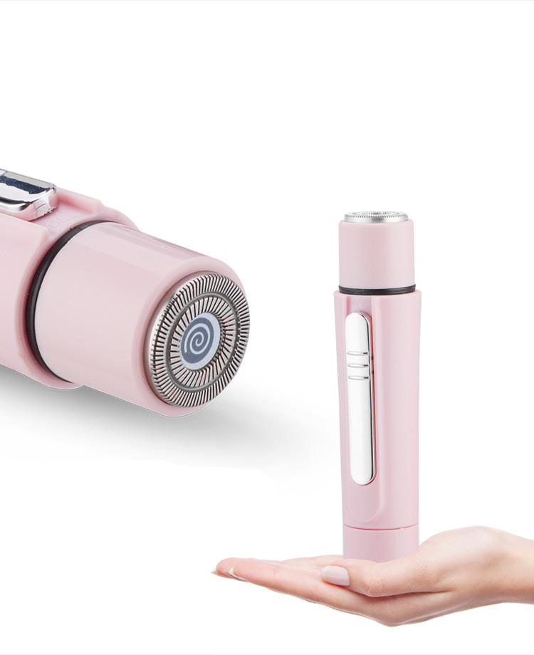 Pink electric shaver with detachable head on a white background