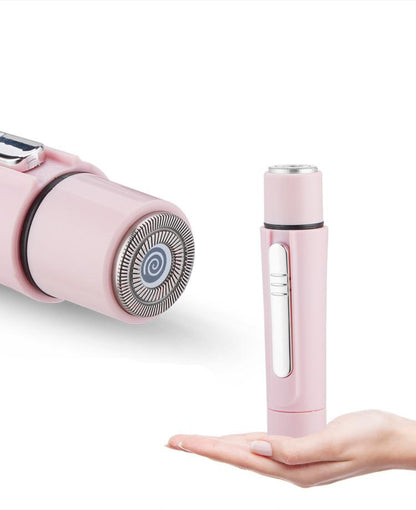 Pink electric shaver with detachable head on a white background