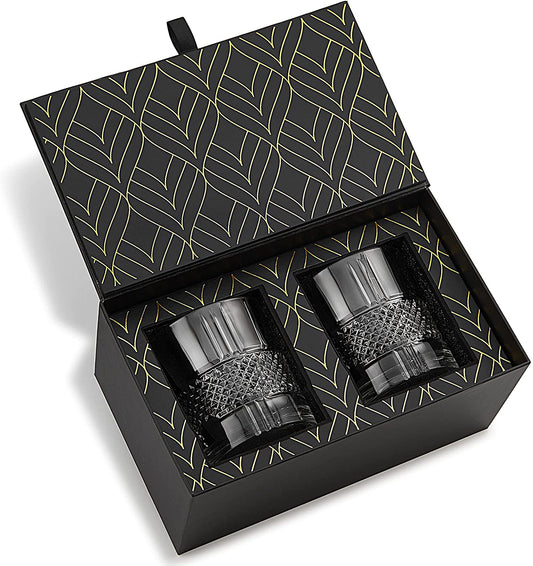 Two black textured tumblers in a decorative box with geometric pattern