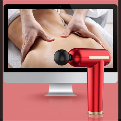Red massage gun being used on a person's back with a computer screen displaying a massage session.