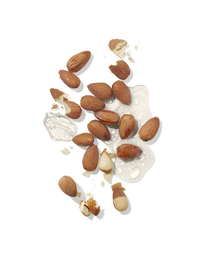 Almonds scattered on a white background