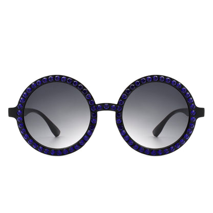 Round sunglasses with blue gemstones on a white background