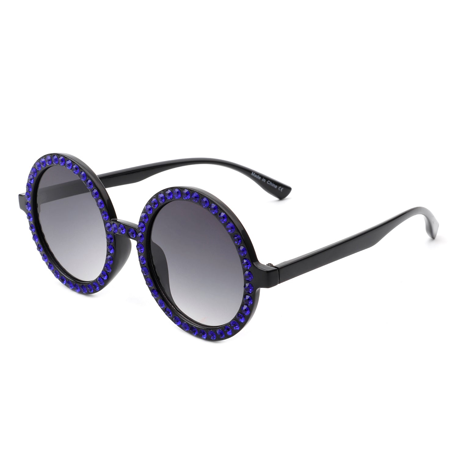 Sunglasses with blue gemstones on a white background