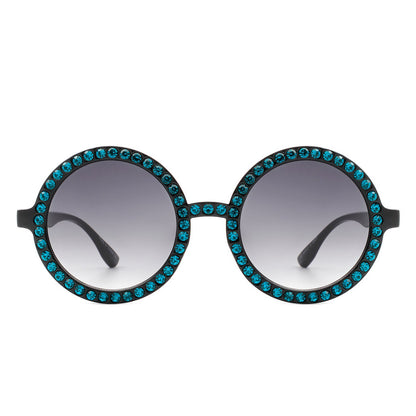 Sunglasses with blue gemstones on a white background