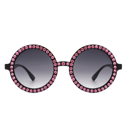 Sunglasses with pink gemstones on a white background