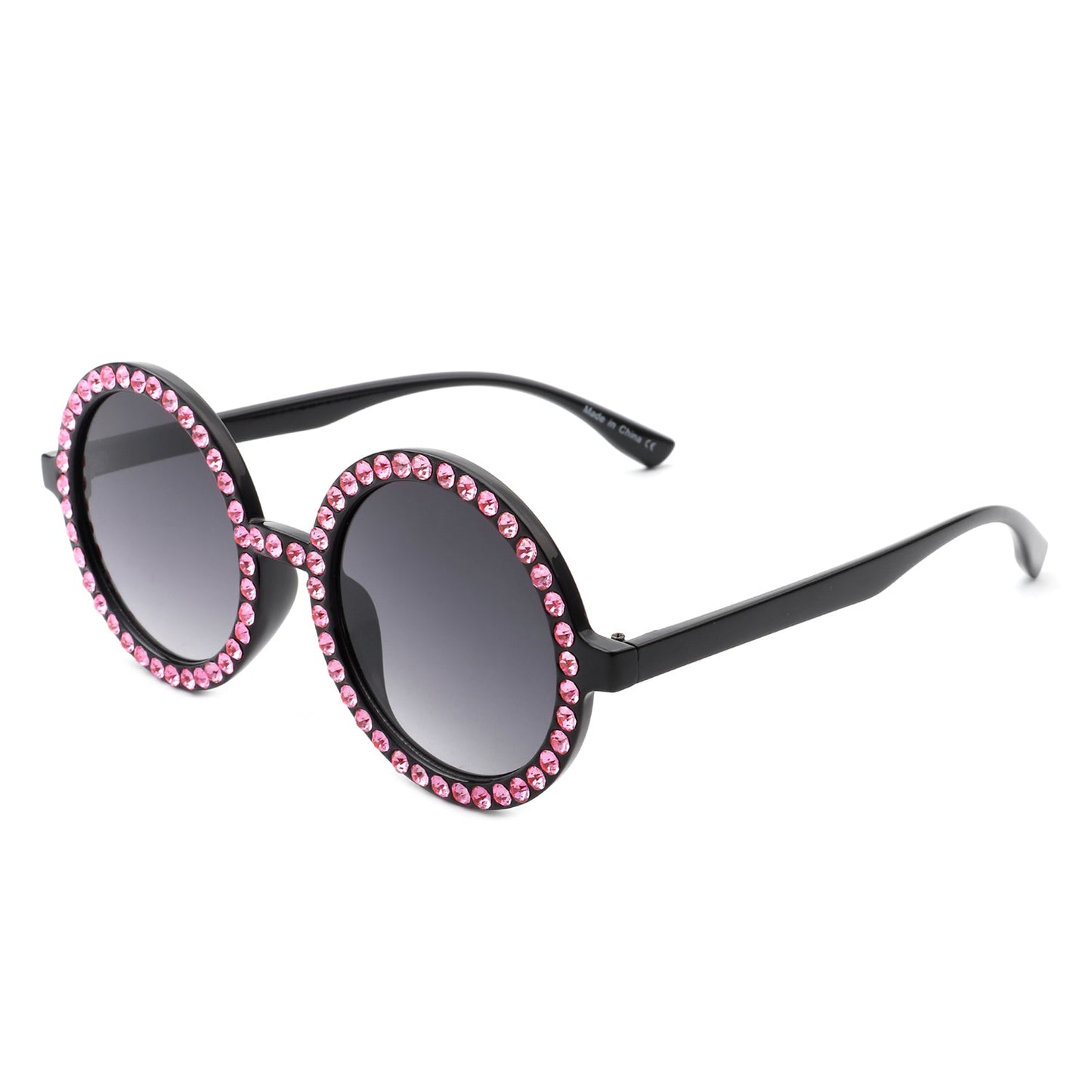 Sunglasses with pink gemstones on a white background