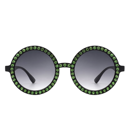 Sunglasses with green gemstones on a white background