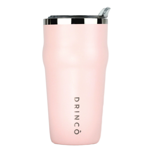 Pink insulated tumbler with silver lid on a white background