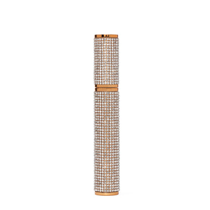 Decorative mascara with rhinestone embellishments on a white background