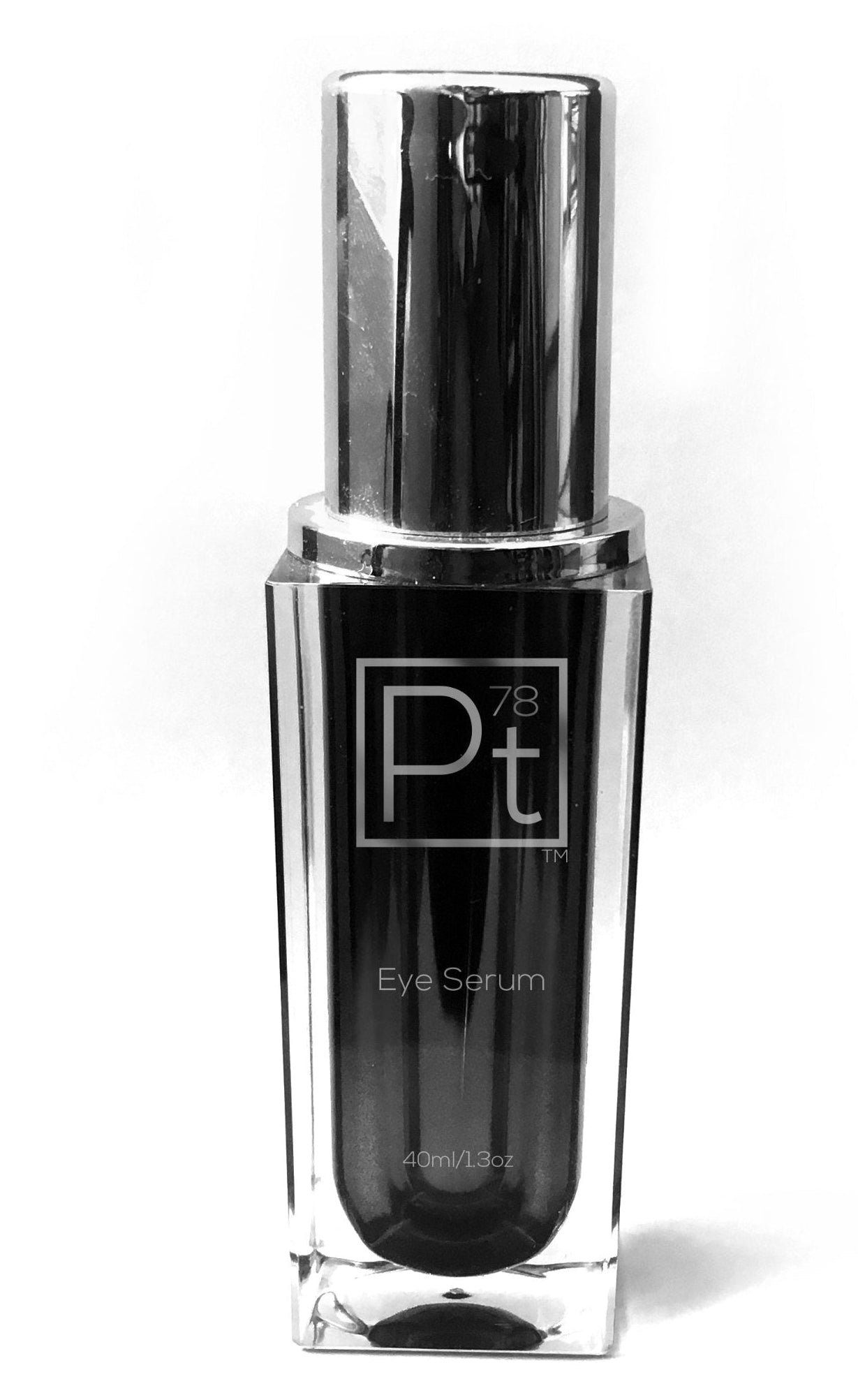 Black eye serum bottle with silver cap on a white background