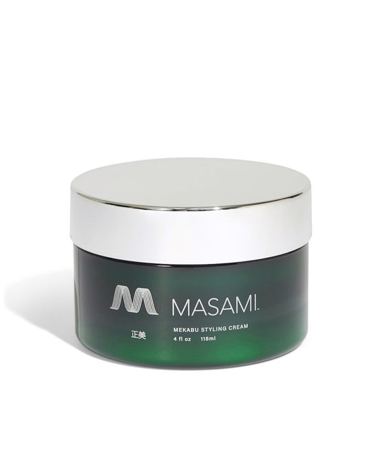 Green jar of MASAMI styling cream with silver lid on a white background