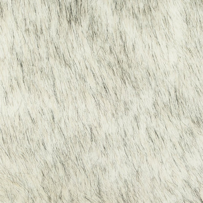 Close-up of a textured faux fur throw blanket surface with a neutral color palette