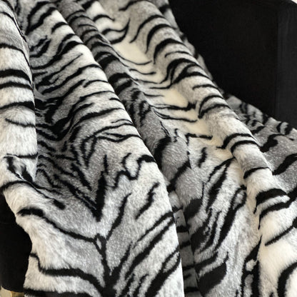 Close-up of a tiger stripe faux fur pattern throw blanket