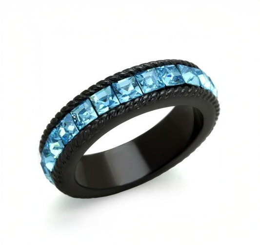 Ring with blue gemstones on a white background