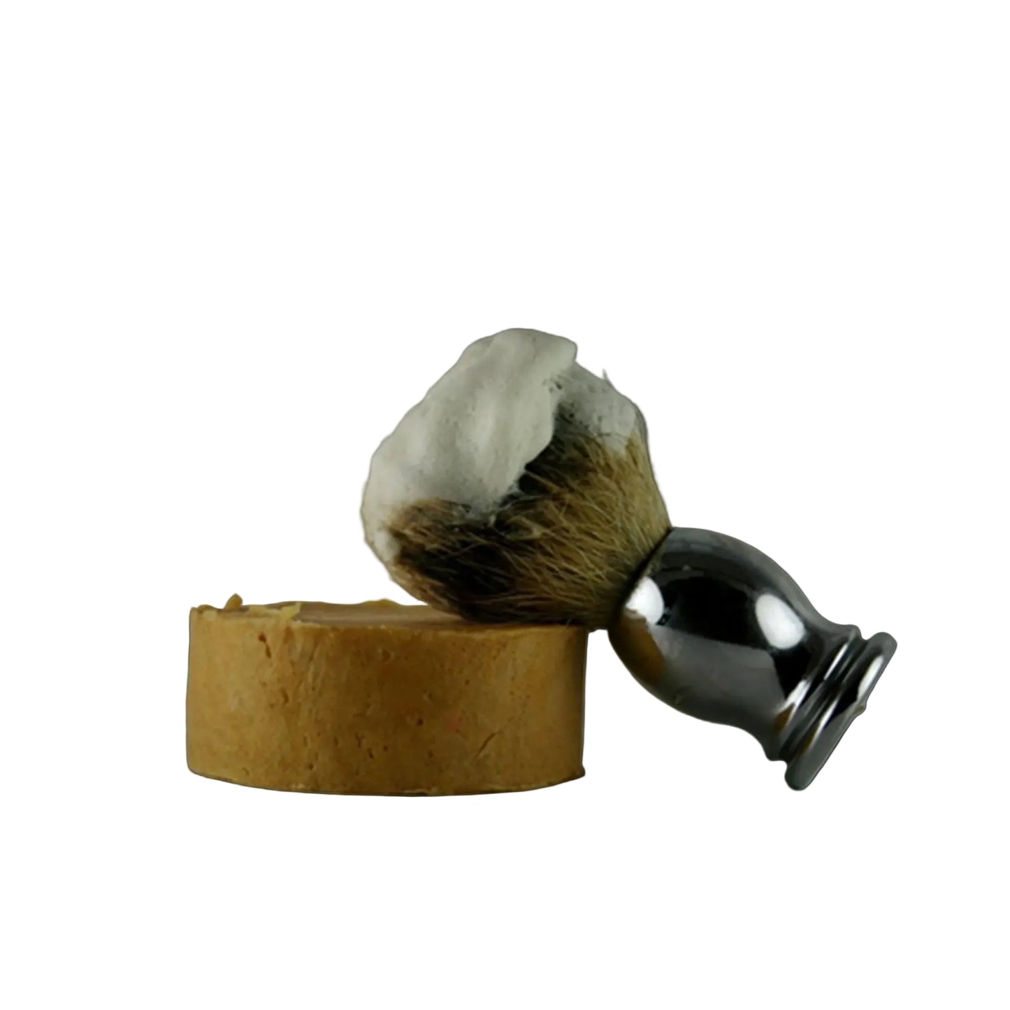 Shaving brush with a stand and a bar of soap on a white background