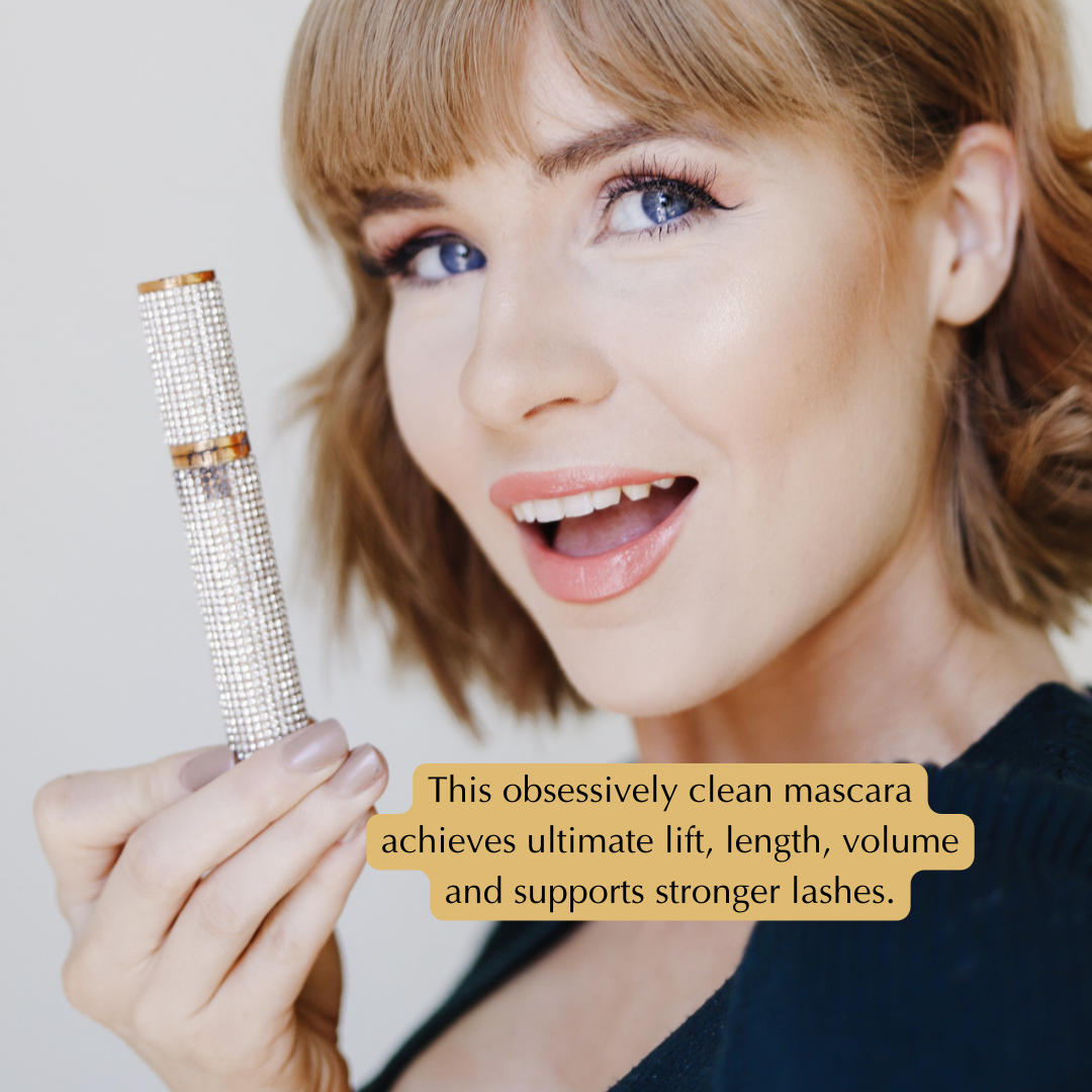 Woman holding a mascara wand with promotional text about its benefits.