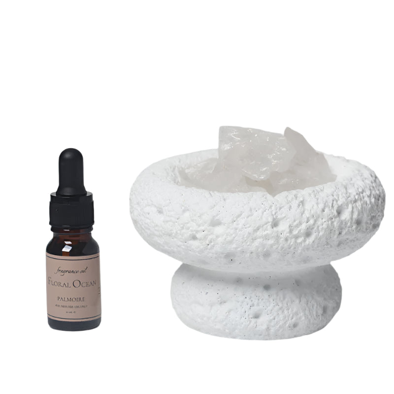 White Moon Diffuser and Floral Ocean fragrance. and a white ceramic bowl with Moon Quartz on a white background