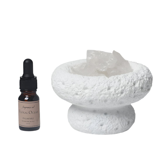 White Moon Diffuser and Floral Ocean fragrance. and a white ceramic bowl with Moon Quartz on a white background