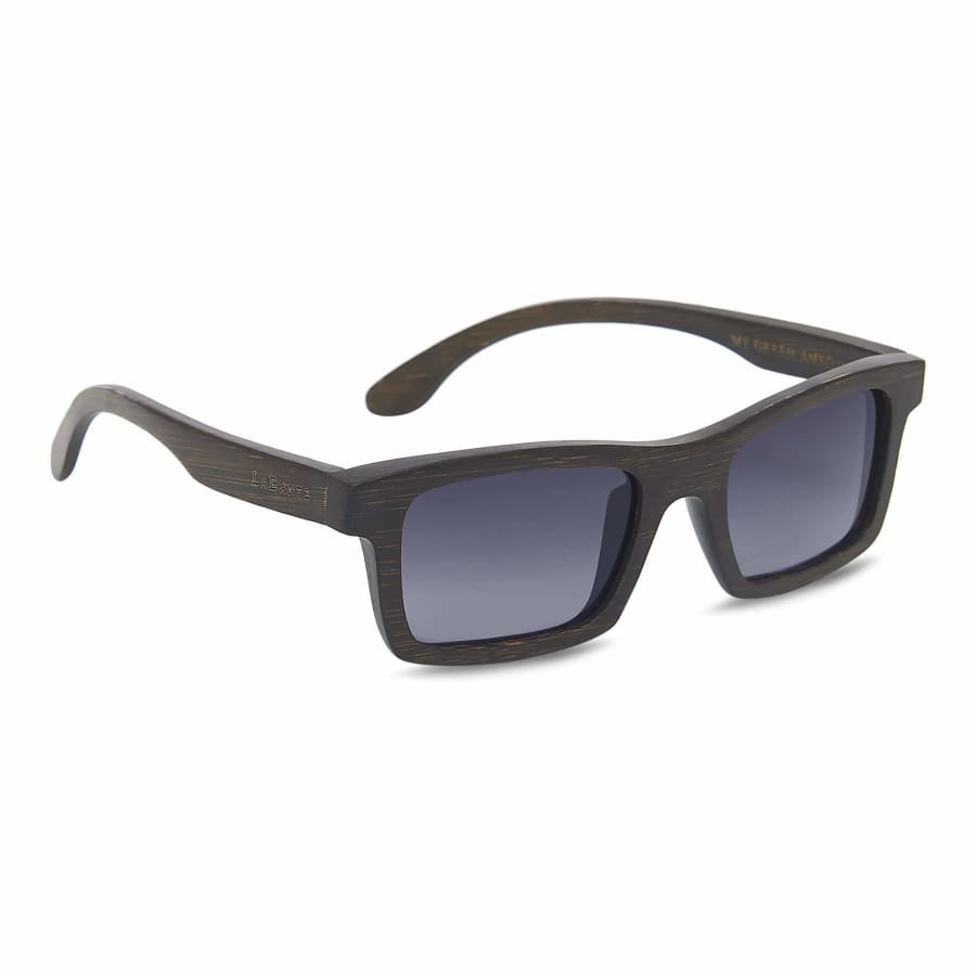 Sunglasses with dark frame and gradient lenses on a white background