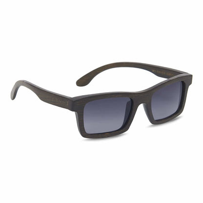Sunglasses with dark frame and gradient lenses on a white background