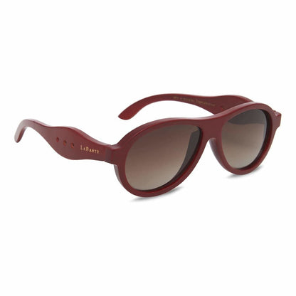 Red sunglasses with a gradient lens on a white background