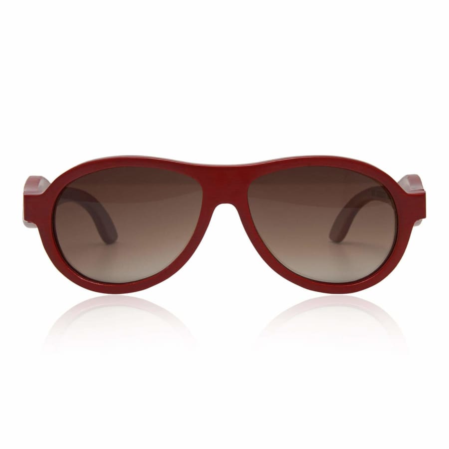 Red sunglasses with brown lenses on a white background