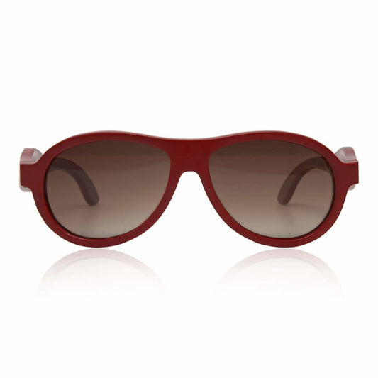 Red sunglasses with brown lenses on a white background