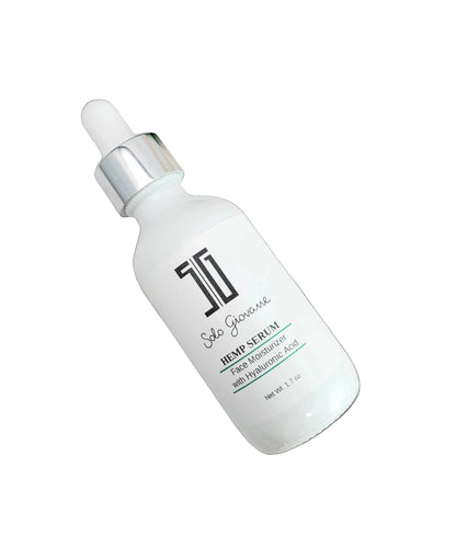 5G Solo Giovanne Skincare serum bottle on a marble surface with green leaves
