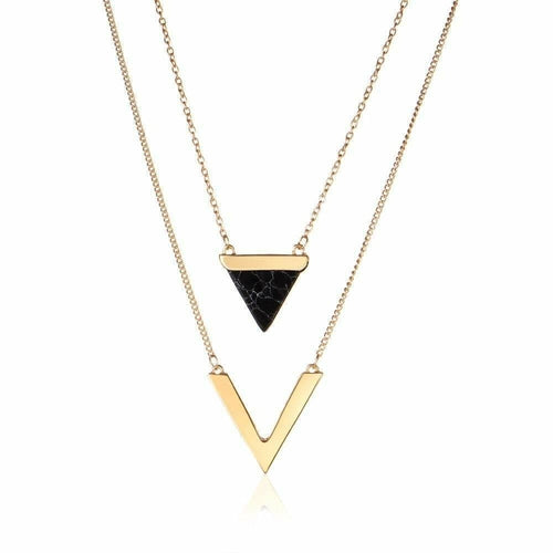 One gold necklaces with triangle and 'V' pendant on a white background