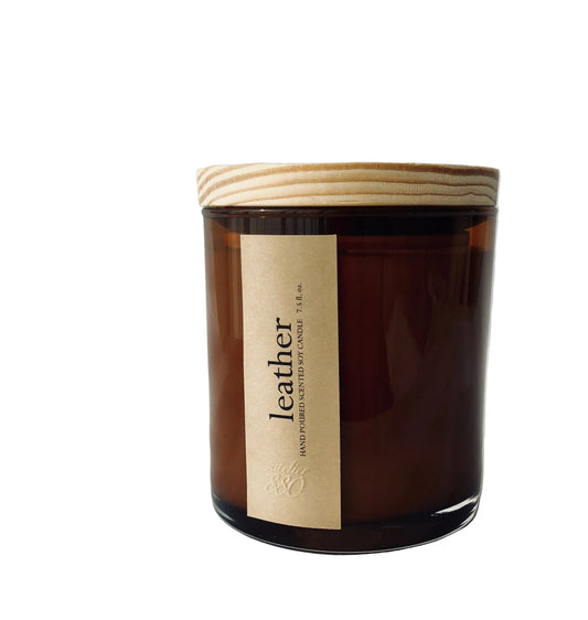 Brown candle leather scent, with a wooden lid on a white background